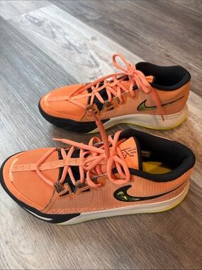Nike Orange Athletic Sneakers with Black and Yellow Details